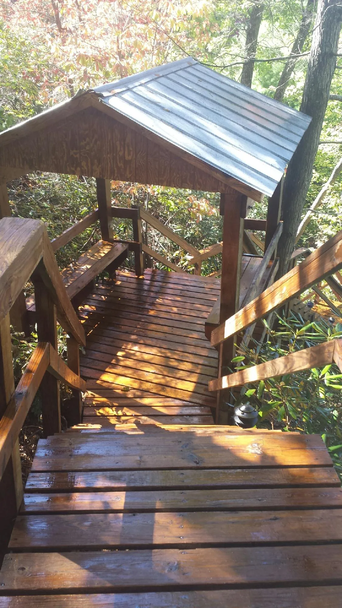 Freshly stained wood walkway and covered shelter with a metal roof in Fe Warren Afb